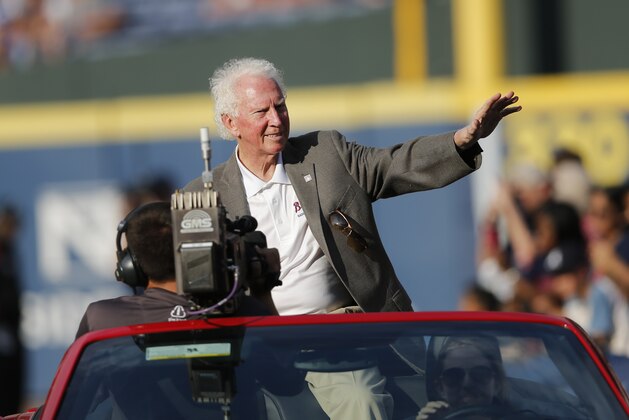 Atlanta Braves board caster and former Los Angeles Dodgers pitcher and baseball Hall of Fame member Don Sutton rides in a car around the field before a baseball game against the Los Angeles Dodgers Monday, July 20, 2015, in Atlanta. Sutton was inducted the Atlanta Braves Hall of Fame earlier in the day.  (AP Photo/John Bazemore)