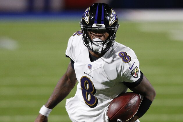 Baltimore Ravens quarterback Lamar Jackson (8) carries the ball during the second half of an NFL football game against the Buffalo Bills in Orchard park, N.Y., Saturday Jan. 16, 2021. (AP/ Photo Jeffrey T. Barnes)