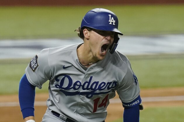 Los Angeles Dodgers' Enrique Hernandez celebrates a RBI-double against the Tampa Bay Rays during the sixth inning in Game 4 of the baseball World Series Saturday, Oct. 24, 2020, in Arlington, Texas. (AP Photo/Eric Gay)