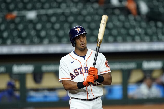 Houston Astros' Michael Brantley strikes out against the Texas Rangers during the fourth inning of a baseball game Wednesday, Sept. 2, 2020, in Houston. (AP Photo/David J. Phillip)