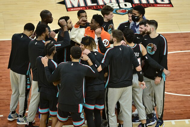 The Memphis Grizzlies huddle before an NBA basketball game against the Philadelphia 76ers Saturday, Jan. 16, 2021, in Memphis, Tenn. (AP Photo/Brandon Dill)