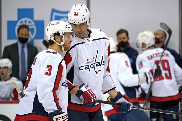 Washington Capitals' Zdeno Chara (33) talks with Nick Jensen during the second period of an NHL hockey game against the Pittsburgh Penguins in Pittsburgh, Sunday, Jan. 17, 2021. (AP Photo/Gene J. Puskar)