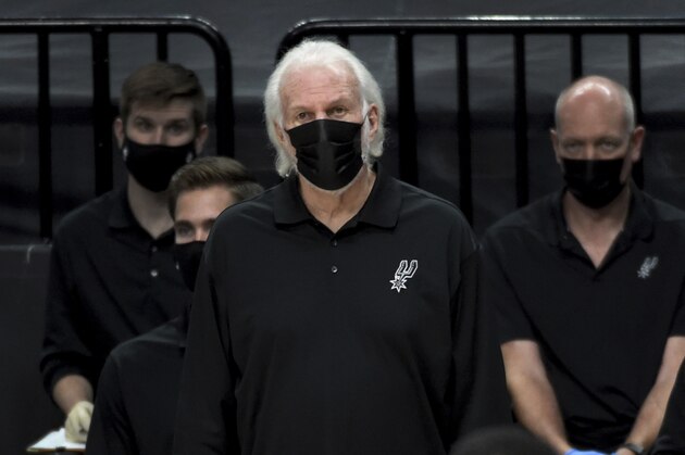 San Antonio Spurs head coach Gregg Popovich looks on from the bench during the second half of an NBA basketball game against the Portland Trail Blazers in Portland, Ore., Monday, Jan. 18, 2021. The Spurs won 125-104. (AP Photo/Steve Dykes)