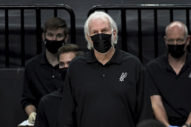 San Antonio Spurs head coach Gregg Popovich looks on from the bench during the second half of an NBA basketball game against the Portland Trail Blazers in Portland, Ore., Monday, Jan. 18, 2021. The Spurs won 125-104. (AP Photo/Steve Dykes)