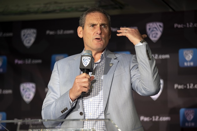 FILE - In this Oct. 8, 2019, file photo, commissioner Larry Scott speaks during the Pac-12 NCAA college basketball media day, in San Francisco. The commissioners of the Atlantic Coast Conference, Big Ten, Big 12, Pac-12 and Southeastern Conference say they have been in almost constant contact since the NCAA men's basketball tournament was canceled on March 12.“ Based on the very positive and close collaboration among the leaders in college football and discussions with schools, other leagues and the medical community, at this point in time we are planning to start the football season on time and together on a national basis,” Pac-12 Commissioner Larry Scott said. (AP Photo/D. Ross Cameron, File)
