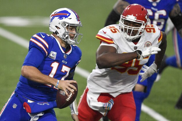 Buffalo Bills quarterback Josh Allen, left, is pressured by Kansas City Chiefs defensive tackle Chris Jones during the first half of an NFL football game, Monday, Oct. 19, 2020, in Orchard Park, N.Y. (AP Photo/Adrian Kraus)