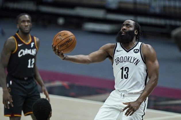 Brooklyn Nets' James Harden drives to the basket against the Cleveland Cavaliers during double overtime of an NBA basketball game, Wednesday, Jan. 20, 2021, in Cleveland. (AP Photo/Tony Dejak)