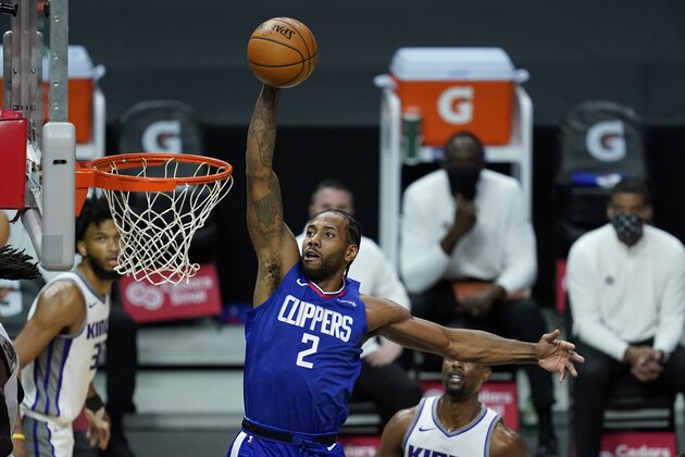 Los Angeles Clippers forward Kawhi Leonard (2) dunks the ball during the first quarter of an NBA basketball game against the Sacramento Kings Wednesday, Jan. 20, 2021, in Los Angeles. (AP Photo/Ashley Landis) Los Angeles Clippers forward Kawhi Leonard (2) dunks the ball during the first quarter of an NBA basketball game against the Sacramento Kings Wednesday, Jan. 20, 2021, in Los Angeles. (AP Photo/Ashley Landis)