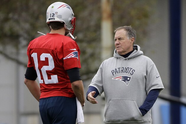 New England Patriots quarterback Tom Brady (12) speaks with head coach Bill Belichick, right, during NFL football practice, Wednesday, Nov. 1, 2017, in Foxborough, Mass. (AP Photo/Steven Senne)