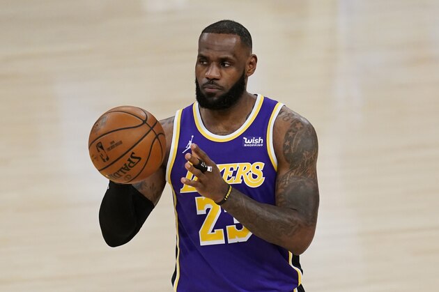 Los Angeles Lakers forward LeBron James (23) passes the ball during the first quarter of an NBA basketball game against the New Orleans Pelicans Friday, Jan. 15, 2021, in Los Angeles. (AP Photo/Ashley Landis)