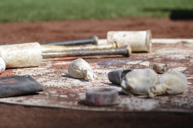 Bat weights, rosin bags, and other materials rest on the New York Yankees on-deck circle during a baseball game against the Seattle Mariners, Sunday, July 23, 2017, in Seattle. (AP Photo/Ted S. Warren)