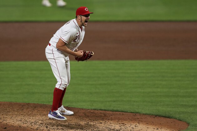 Cincinnati Reds' Trevor Bauer reacts to striking out Milwaukee Brewers' Daniel Vogelbach during the sixth inning of a baseball game in Cincinnati, Wednesday, Sept. 23, 2020. (AP Photo/Aaron Doster)