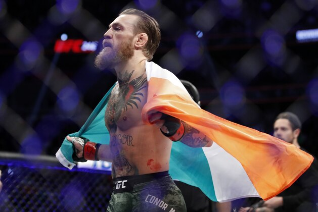 Conor McGregor celebrates after defeating Donald