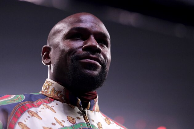 Floyd Mayweather looks on from the ring prior to a super featherweight boxing championship bout between Ricardo Nunez and Gervonta Davis, Saturday, July 27, 2019, in Baltimore. (AP Photo/Julio Cortez)
