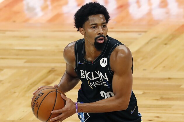 Brooklyn Nets' Spencer Dinwiddie plays against the Boston Celtics during the first half of an NBA basketball game, Friday, Dec. 25, 2020, in Boston. (AP Photo/Michael Dwyer)