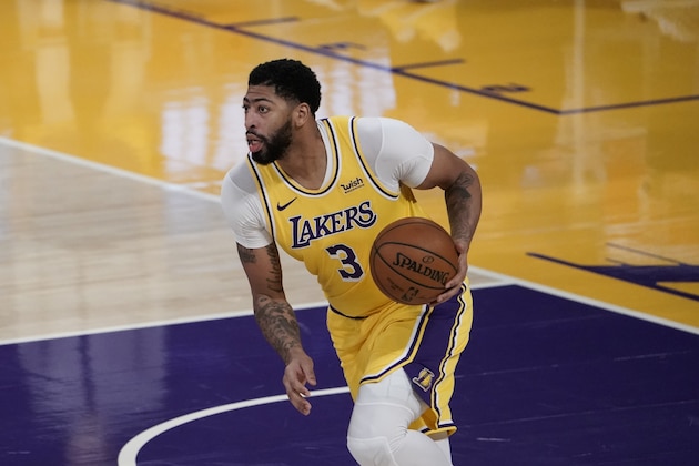 Los Angeles Lakers' Anthony Davis dribbles the ball during the first half of an NBA basketball game against the Golden State Warriors, Monday, Jan. 18, 2021, in Los Angeles. (AP Photo/Jae C. Hong)