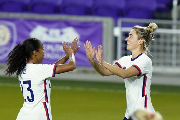 United States midfielder Kristie Mewis, right, celebrates her goal against Colombia with defender Margaret Purce, left, during the second half of an international friendly soccer match, Monday, Jan. 18, 2021, in Orlando, Fla. (AP Photo/John Raoux)