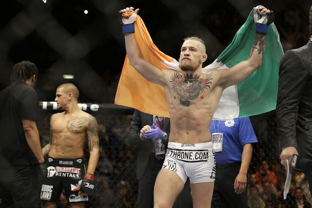 Conor McGregor celebrates after defeating Dustin Poirier in their featherweight mixed martial arts bout at UFC 178 on Saturday, Sept. 27, 2014, in Las Vegas. (AP Photo/John Locher)