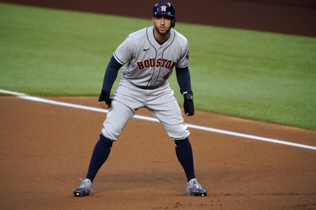 Houston Astros' George Springer takes a lead off of first in the first inning of a baseball game against the Texas Rangers in Arlington, Texas, Friday, Sept. 25, 2020. (AP Photo/Tony Gutierrez)