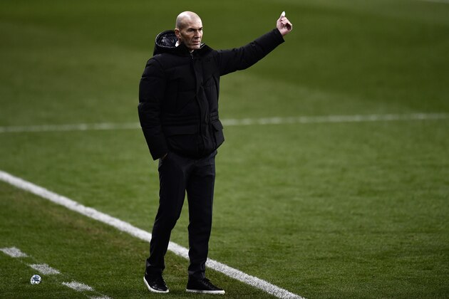 Real Madrid's head coach Zinedine Zidane gives instructions from the side line during Spanish Super Cup semi final soccer match between Real Madrid and Athletic Bilbao at La Rosaleda stadium in Malaga, Spain, Thursday, Jan. 14, 2021. Athletic Bilbao won 2-1 and will play the final. (AP Photo/Jose Breton)