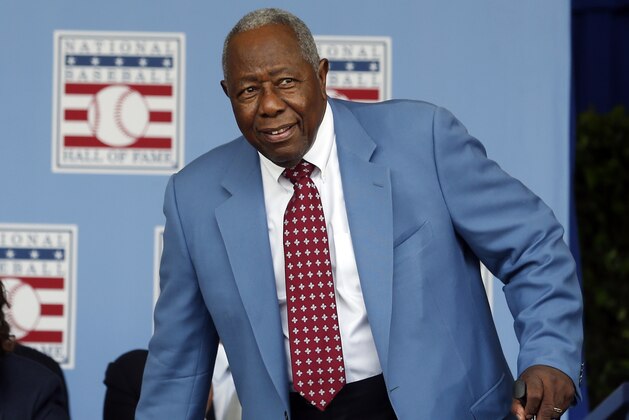 National Baseball Hall of Famer Hank Aaron arrives for an induction ceremony at the Clark Sports Center on Sunday, July 26, 2015, in Cooperstown, N.Y. (AP Photo/Mike Groll)