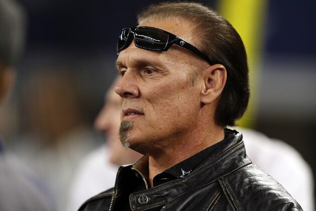 Steve Borden, known as Sting of WWE fame, watches the Detroit Lions and Dallas Cowboys warm up before an NFL football game, Monday, Dec. 26, 2016, in Arlington, Texas. (AP Photo/Brandon Wade)