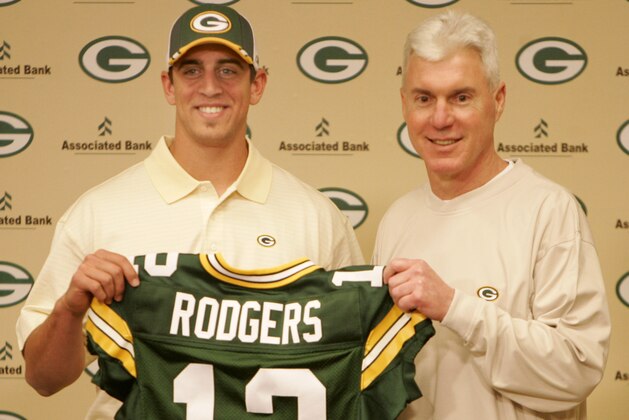 FILE - In this April 24, 2005, file photo, Green Bay Packers general manager Ted Thompson stands next to the team's first-round pick, California quarterback Aaron Rodgers, during an NFL football a news conference in Green Bay, Wis. Thompson, whose 13-year run as Green Bay Packers general manager included their 2010 Super Bowl championship season, died Wednesday, Jan 20, the team announced Thursday, Jan. 21, 2021. He was 68. Thompson was Packers general manager from 2005-17 and drafted many notable players on the current roster, including two-time MVP quarterback Aaron Rodgers. (AP Photo/Mike Roemer, File)