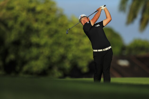 Sungjae Im, of South Korea, follows his shot from the 11th tee box during the first round of the Sony Open golf tournament Thursday, Jan. 14, 2021, at Waialae Country Club in Honolulu. (AP Photo/Jamm Aquino)