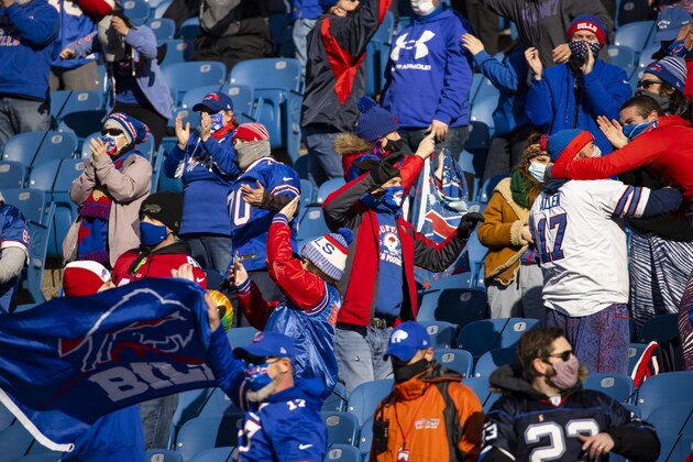 Buffalo Bills fans celebrate during the first quarter of an NFL wild-card playoff football game against the Indianapolis Colts, Saturday, Jan. 9, 2021, in Orchard Park, N.Y. (AP Photo/Brett Carlsen)
