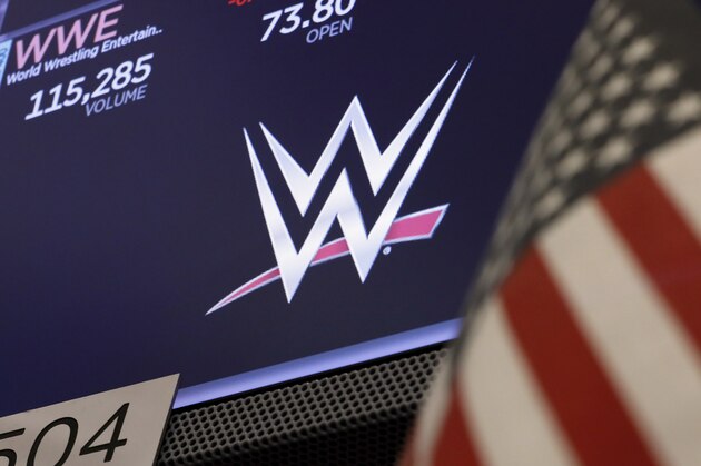The logo for World Wrestling Entertainment, WWE, appears above a trading post on the floor of the New York Stock Exchange, Friday, Sept. 13, 2019. (AP Photo/Richard Drew)