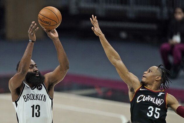 Brooklyn Nets' James Harden (13) shoots over Cleveland Cavaliers' Isaac Okoro (35) during the second half of an NBA basketball game, Friday, Jan. 22, 2021, in Cleveland. (AP Photo/Tony Dejak)