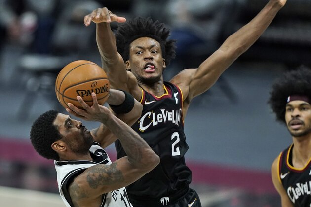Brooklyn Nets' Kyrie Irving, left, shoots against Cleveland Cavaliers' Collin Sexton in the second half of an NBA basketball game, Friday, Jan. 22, 2021, in Cleveland. The Cavaliers won 125-113. (AP Photo/Tony Dejak) Brooklyn Nets' Kyrie Irving, left, shoots against Cleveland Cavaliers' Collin Sexton in the second half of an NBA basketball game, Friday, Jan. 22, 2021, in Cleveland. The Cavaliers won 125-113. (AP Photo/Tony Dejak)