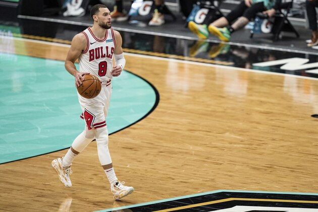 Chicago Bulls guard Zach LaVine (8) brings the ball up court against the Charlotte Hornets during an NBA basketball game in Charlotte, N.C., Friday, Jan. 22, 2021. (AP Photo/Jacob Kupferman)