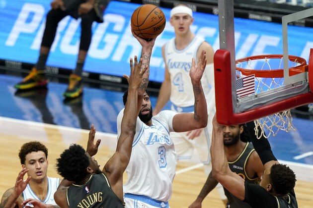 Los Angeles Lakers forward Anthony Davis, center, shoots against the Chicago Bulls during the second half of an NBA basketball game in Chicago, Saturday, Jan. 23, 2021. (AP Photo/Nam Y. Huh)