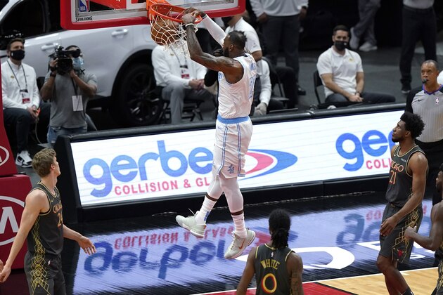 Los Angeles Lakers forward LeBron James dunks against the Chicago Bulls during the first half of an NBA basketball game in Chicago, Saturday, Jan. 23, 2021. (AP Photo/Nam Y. Huh)