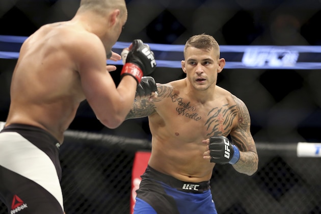Dustin Porier, right, fights Eddie Alvarez in a mixed martial arts bout at UFC 211 on Saturday, May 13, 2017, in Dallas. The fight was ruled a no contest after an accidental foul. (AP Photo/Gregory Payan)