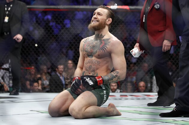 Conor McGregor smiles after defeating Donald