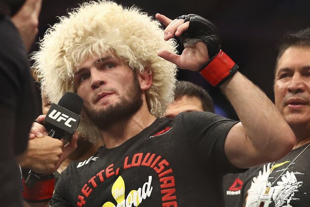 Russian UFC fighter Khabib Nurmagomedov speaks after wining against UFC fighter Dustin Poirier, of Lafayette, La., during Lightweight title mixed martial arts bout at UFC 242, in Yas Mall in Abu Dhabi, United Arab Emirates, Saturday , Sept.7 2019. (AP Photo/ Mahmoud Khaled)