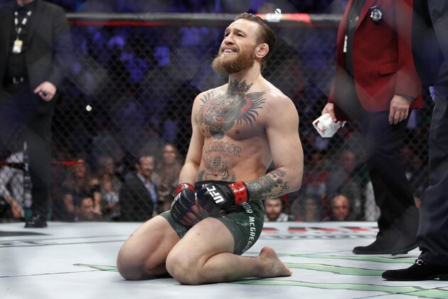 Conor McGregor smiles after defeating Donald
