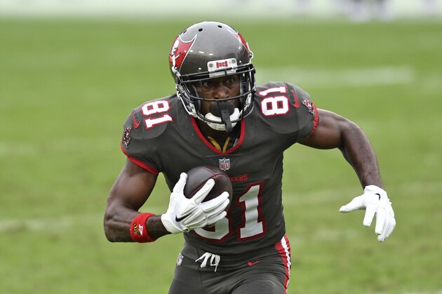 Tampa Bay Buccaneers wide receiver Antonio Brown (81) runs with the ball after a reception during the second half of an NFL football game against the Atlanta Falcons Sunday, Jan. 3, 2021, in Tampa, Fla. (AP Photo/Jason Behnken)