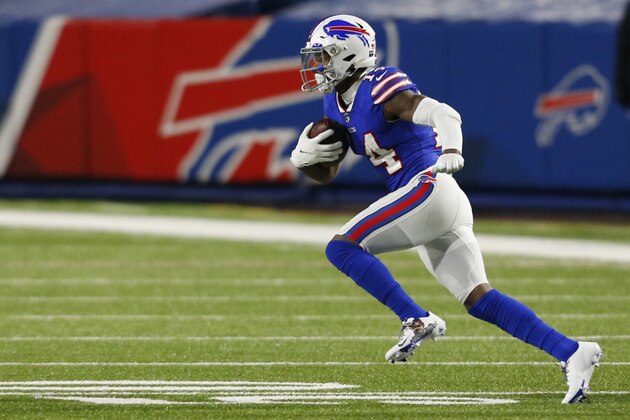 Buffalo Bills receiver Stefon Diggs (14) runs after a catch during the second half of an NFL football game against the Baltimore Ravens in Orchard park, N.Y., Saturday Jan. 16, 2021. (AP/ Photo Jeffrey T. Barnes)
