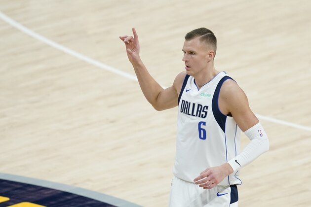 Dallas Mavericks' Kristaps Porzingis (6) reacts after hitting a shot during the second half of an NBA basketball game against the Indiana Pacers, Wednesday, Jan. 20, 2021, in Indianapolis. (AP Photo/Darron Cummings)