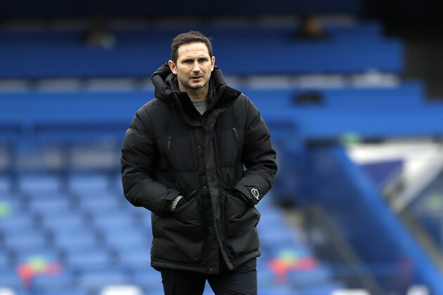 Chelsea's head coach Frank Lampard looks on during warm up before the English FA Cup third round soccer match between Chelsea and Morecambe at Stamford Bridge Stadium in London, Sunday, Jan. 10, 2021. (AP Photo/Matt Dunham)