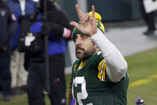 Green Bay Packers quarterback Aaron Rodgers waves to spectators after an NFL divisional playoff football game against the Los Angeles Rams Saturday, Jan. 16, 2021, in Green Bay, Wis. The Packers defeated the Rams 32-18 to advance to the NFC championship game. (AP Photo/Mike Roemer)