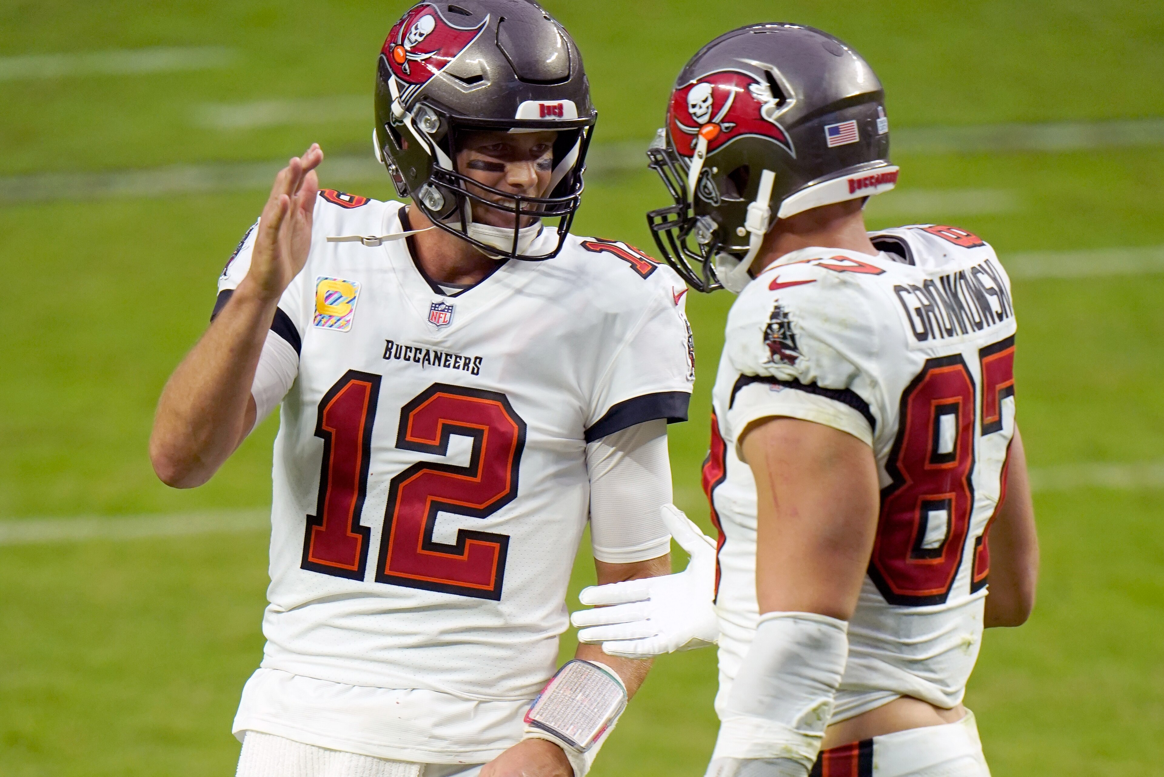 Tampa Bay Buccaneers quarterback Tom Brady (12) celebrates with teammate tight end Rob Gronkowski (87) after scoring a touchdown against the Las Vegas Raiders during the second half of an NFL football game, Sunday, Oct. 25, 2020, in Las Vegas. (AP Photo/Jeff Bottari) Tampa Bay Buccaneers quarterback Tom Brady (12) celebrates with teammate tight end Rob Gronkowski (87) after scoring a touchdown against the Las Vegas Raiders during the second half of an NFL football game, Sunday, Oct. 25, 2020, in Las Vegas. (AP Photo/Jeff Bottari)