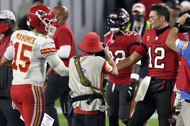 Tampa Bay Buccaneers quarterback Tom Brady (12) congratulates Kansas City Chiefs quarterback Patrick Mahomes (15) after their NFL football game Sunday, Nov. 29, 2020, in Tampa, Fla. (AP Photo/Jason Behnken)