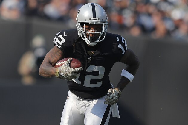 Oakland Raiders wide receiver Martavis Bryant (12) runs during the first half of an NFL football game against the Los Angeles Chargers in Oakland, Calif., Sunday, Nov. 11, 2018. (AP Photo/John Hefti)