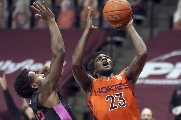 Virginia Tech's Tyrece Radford (23) shoots past Penn State's Izaiah Brockington (12) during the first half of an NCAA college basketball game, Tuesday, Dec. 8, 2020 in Blacksburg Va. (Matt Gentry/The Roanoke Times via AP, Pool)