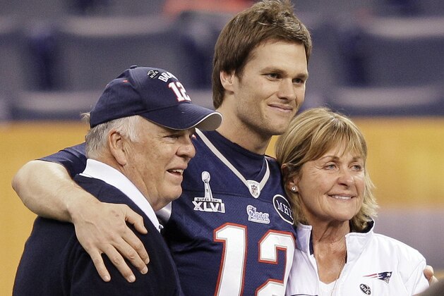 New England Patriots quarterback Tom Brady (12) poses for a photo with his parents, Tom and Galynn Brady, in Lucas Oil Stadium on Saturday, Feb. 4, 2012, in Indianapolis. The Patriots are scheduled to face the New York Giants in NFL football Super Bowl XLVI on Feb. 5. (AP Photo/Mark Humphrey)