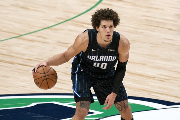 Orlando Magic forward Aaron Gordon (00) dribbles during an NBA basketball game against the Dallas Mavericks, Saturday, Jan. 9, 2021, in Dallas. Dallas won 112-98. (AP Photo/Jeffrey McWhorter)